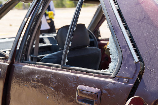 broken car window from car bomb in crime scene