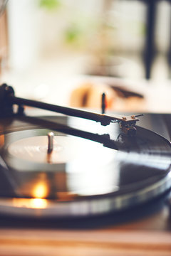 Record player spinning the disc with music