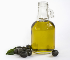 olive oil bottle with olives on white background