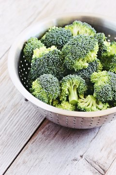 Fresh broccoli on a rustic wooden table