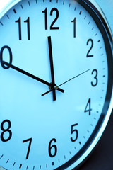 Clock face in blue light closeup