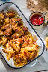 Homemade chicken wings in rustic kitchen