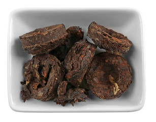 Puer tea in bowl, isolated on white