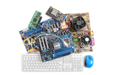 Computer motherboards with fans, keyboard and mouse, isolated on white