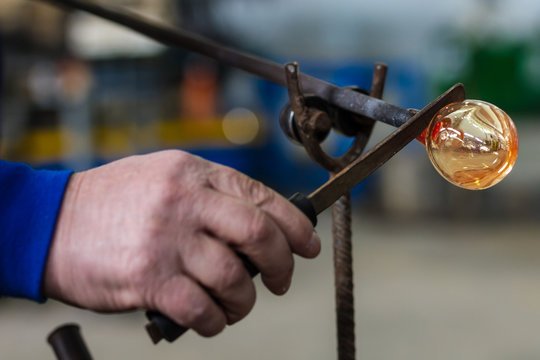 Glass crafting worker make glass souvenir