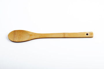 Wooden spoon for cooking on white background