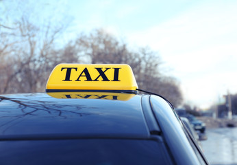 Taxi sign on car, closeup