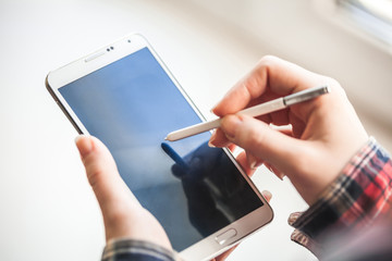 woman holding mobile phone close-up shot
