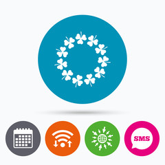 Wreath of clovers with three leaves sign.