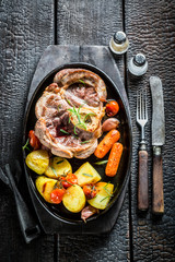 Grilled vegetables and steak with herbs on grill
