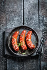Plexiglas foto achterwand Roasted sausage with fresh rosemary © shaiith