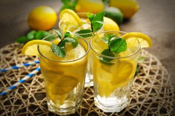 Group of lemonades with lemon and mint on stand