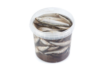 Salted herrings in a plastic pot