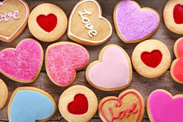 Assortment of love cookies on wooden background, closeup