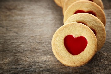 Group of love cookies on wooden background, closeup