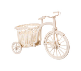 The white plastic bicycle on a white background isolated, a decor for the house and a garden