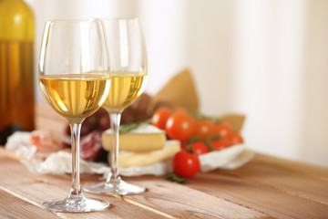 Glasses of wine with food on table closeup