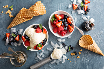 Vanilla ice cream scoops with berries