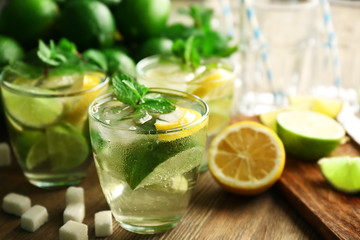 Mojito drinks with lime, lemon and mint, closeup