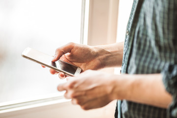 men holding mobile phone close-up shot