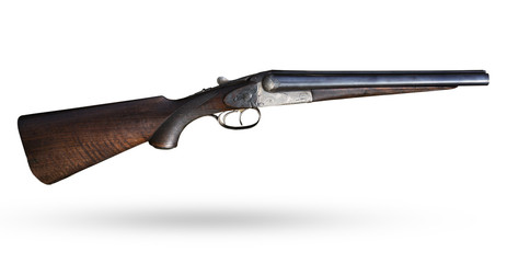 Old rifle on white background. Isolated short gun with wooden butt. Lovely historical isolated...