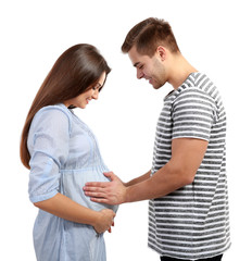 Young pregnant woman with husband isolated on white