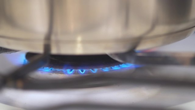 Gas burner turning on a kitchen stove
