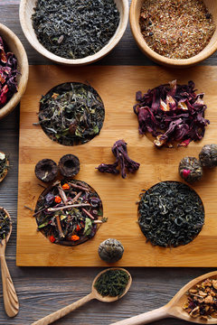 Tea concept. Different kinds of tea on wooden background