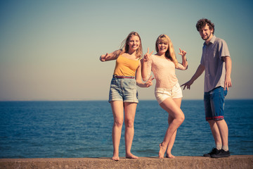 Group friends boy two girls having fun outdoor