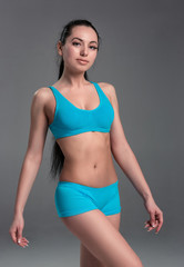 Fototapeta premium Muscular young woman athlete standing