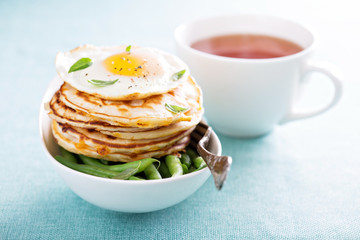 Cheese pancakes with green beans and egg