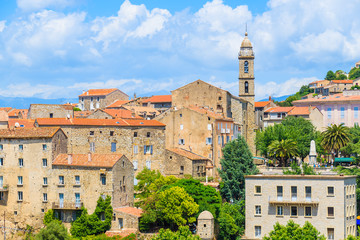 View of church in Sartene village with stone houses built in traditional Corsican style, France