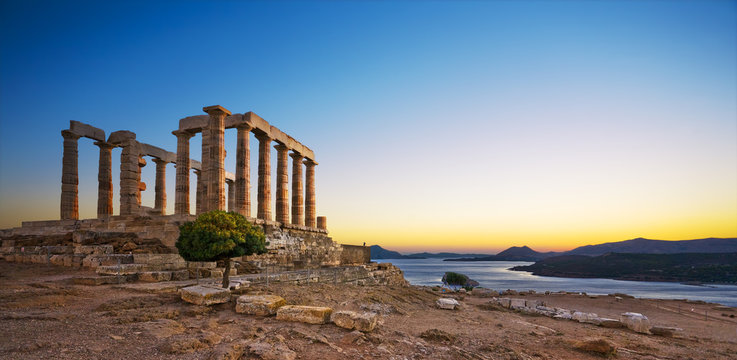 Fototapeta Greece. Cape Sounion - Ruins of an ancient Greek temple of Poseidon after sunset