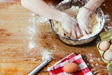 Girl in the kitchen playing with flour