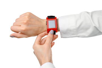 Modern watch on a woman's wrist isolated on white