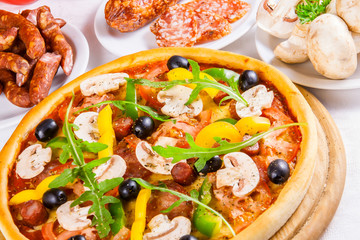 Pizza with vegetable and salami