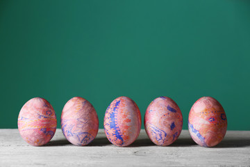 Easter eggs on green background