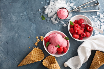 Raspberry ice cream in white bowl