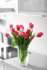 Fresh bouquet of tulips on a kitchen counter.
