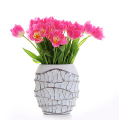 Fresh bouquet of tulips in a vase isolated on white