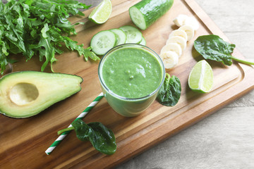 Fresh avocado smoothie on wooden board