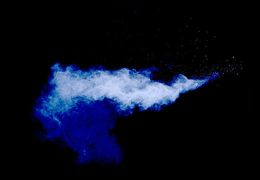 Cloud of powder on dark blue background