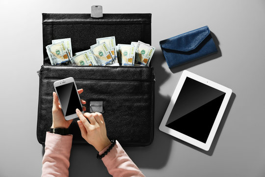 Businesswoman And Brief Case With Money