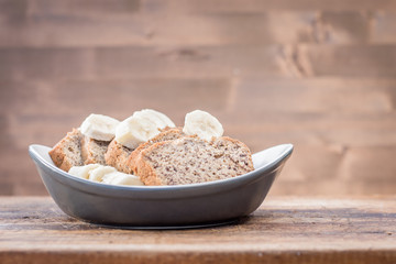 banana cake slices. Isolated on wooden background