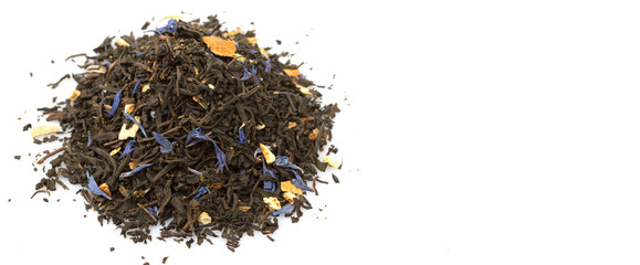 Dried black Earl Grey tea leaves over white background