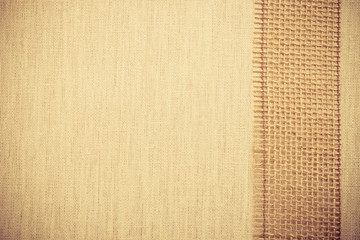 Fototapeta premium Jute ribbon on linen cloth background