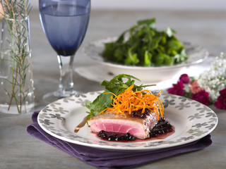 Tuna Steak in blackberry sauce in fine dining setting