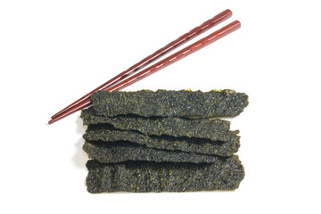 Seaweed with chopsticks on white background
