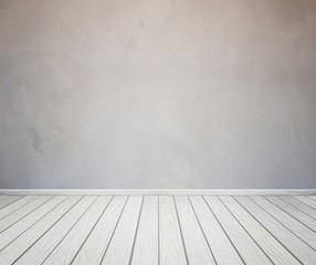 room interior with concrete wall and wood floor