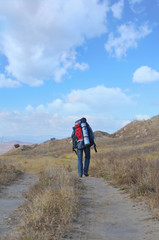 A tourist walks along the trail